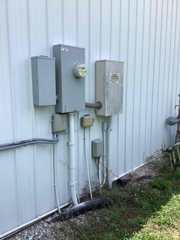 Performed comprehensive maintenance inspection on Generac Centurion 45KW liquid-cooled standby generator. Conducted thorough examination of transfer switch operation and associated fuses following reported issues during previous power outage. Verified proper functionality of automatic transfer switch through controlled transfer test with customer approval. Inspected all electrical connections at main service panel, meter base, and generator disconnect. Examined fuel supply lines, cooling system components, and control panel operations. Confirmed generator unit mechanical condition, verified proper mounting on concrete pad, and checked all external conduit connections for security and weatherproofing. All systems tested and operating within manufacturer specifications.