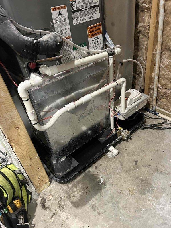 Responded to no cooling complaint on 3-year-old system still under parts warranty. Found recurring condensate drain line blockages with standing water in drain pan. Upon inspection, discovered significant drywall dust contamination throughout the system due to ongoing home remodeling. Performed comprehensive system evaluation including evaporator coil inspection, which revealed dust accumulation on coil fins and in condensate collection area. Cleared drain line obstruction and assessed drain system for potential repairs needed to prevent future clogs. Documented system condition with photographs showing dust-laden evaporator coils and contaminated drain pan. Recommended thorough system cleaning to remove construction debris, potential drain line modifications to improve drainage, and frequent filter changes during remainder of remodel to protect equipment and maintain warranty coverage.
