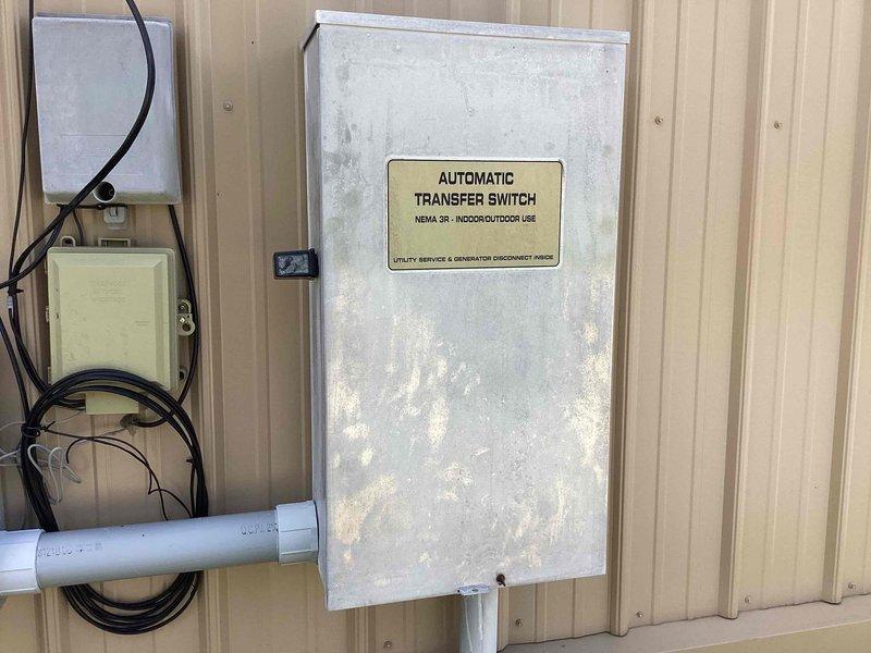 # Generator Maintenance Service

Performed comprehensive preventive maintenance on a 45KW liquid-cooled Generac generator system. Service included inspection of the automatic transfer switch (NEMA 3R rated for indoor/outdoor use), which showed signs of exterior weathering and surface oxidation consistent with outdoor exposure. Verified proper operation of utility service and generator disconnect functions within the transfer switch enclosure.

Conducted visual inspection of associated electrical components, conduit connections, and PVC piping infrastructure supporting the generator installation. Examined generator unit positioning and clearance requirements in the exterior maintenance area. All electrical connections were inspected for integrity and proper termination. System tested and confirmed operational status upon completion of maintenance procedures.