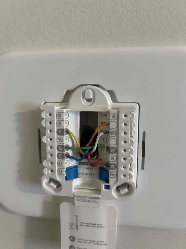 Responded to callback for strong odor complaint from newly installed HVAC system near return vents by thermostat. Inspected thermostat wiring connections and outdoor unit electrical terminations, verifying all wire connections were secure and properly terminated with no signs of overheating or burning that would cause odor issues. Determined system wiring and electrical components were installed correctly per manufacturer specifications.