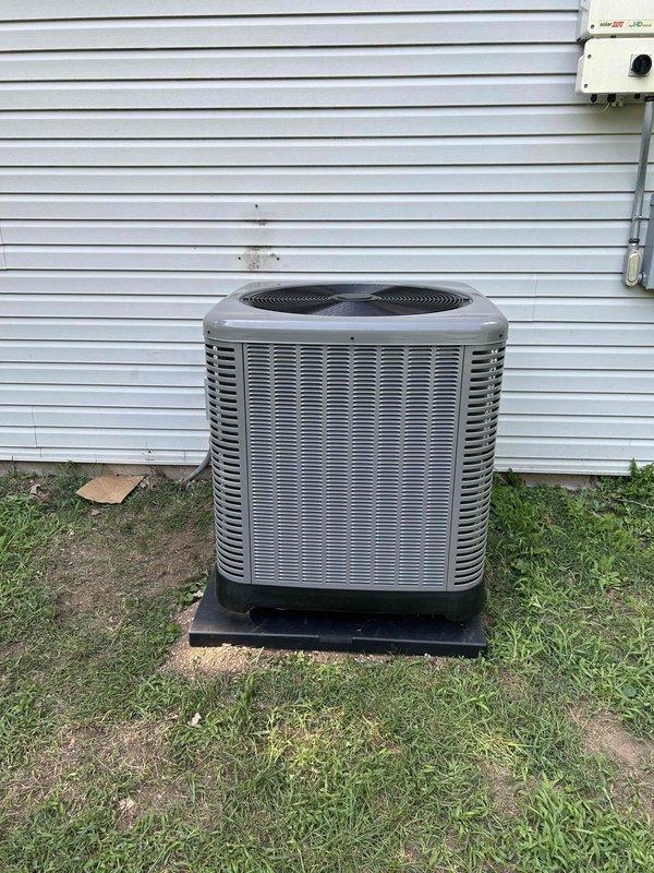 Completed full residential heat pump system installation featuring a Ruud 14.3 SEER2 two-stage 3.5 ton heat pump (model RP14AY42AJ2NA) with matching air handler (RH2TY4821STANNA) and auxiliary heat kit (JRXBH-1724A15J-B). Removed and disposed of existing HVAC equipment, then installed new outdoor heat pump unit on composite pad with snow legs for elevated clearance. Installed electrical disconnect box, whip kit, and ran refrigerant lines with proper insulation and inline filter. Mounted indoor air handler with transition to existing ductwork, integrated auxiliary electric heat kit, and installed overflow drain pan with water sensor, trap, and SS2 coil drain safety sensor for flood protection. Added standard-sized filter rack and programmed new digital thermostat for two-stage operation. Secured all applicable permits, verified code compliance, tested system operation across both heating and cooling stages, and confirmed proper refrigerant charge and airflow. System operational and cust