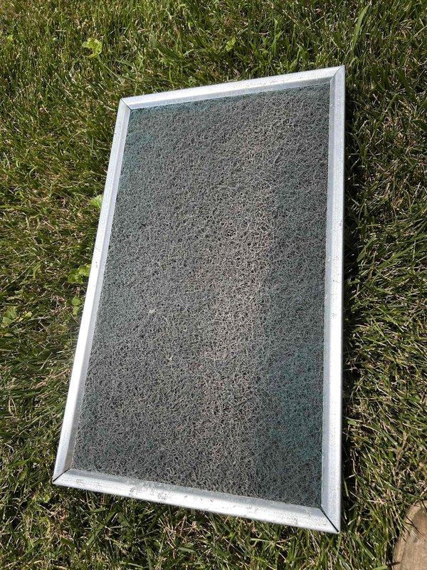 Responded to no cooling complaint on system less than 10 years old. Upon arrival, performed diagnostic assessment of HVAC system including temperature measurements at supply registers and ductwork in crawl space area, which indicated 75°F reading. Inspected and removed heavily soiled air filter showing significant dust and debris accumulation, which was restricting airflow and contributing to reduced system performance. Documented system conditions through photography for service records. Advised on proper filter maintenance schedule to prevent future airflow restrictions and maintain optimal system efficiency.