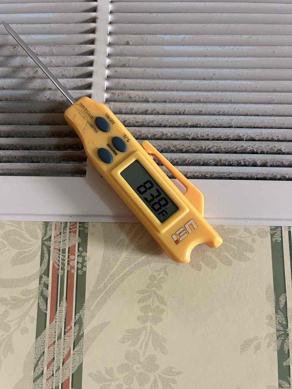 Responded to no cooling call on Goodman furnace/AC system with error code. Performed diagnostic evaluation and found failed run capacitor on outdoor condensing unit. Verified system temperatures at indoor unit showing elevated supply air temperature of 93°F, confirming lack of cooling. Replaced defective TITAN PRO run capacitor (model TRCFD405) with proper electrical connections, restored system operation, and verified proper cooling cycle. Noted heavily soiled air filter at indoor unit requiring replacement for optimal airflow and system efficiency.