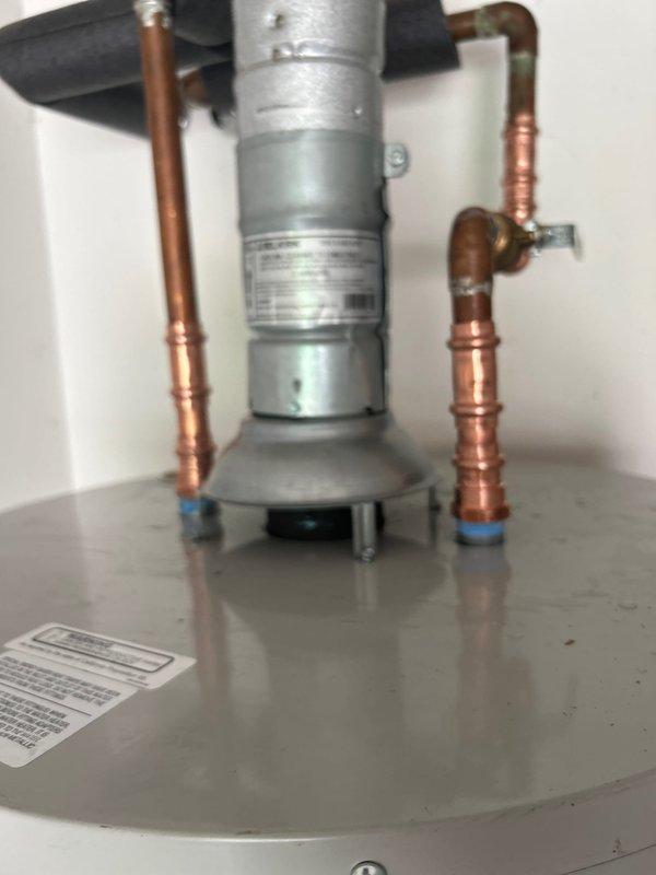 Installed a Bradford White 50-gallon gas water heater with short configuration, including all necessary copper piping connections, shut-off valves, and proper venting. Additionally replaced a shower cartridge to restore proper temperature control and water flow functionality.