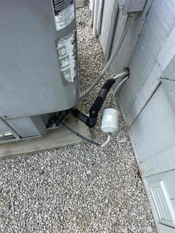 Responded to no-cool complaint on 12-year-old residential air conditioning system with inadequate cooling performance (thermostat set to 76°F but only reaching 79°F). Upon inspection, found outdoor condensing unit and indoor air handler with aged flexible ductwork showing significant dust accumulation and insulation wear in attic installation. Performed system diagnostics including temperature differential measurements, refrigerant pressure checks, and airflow assessment. Identified reduced cooling capacity consistent with system age and potential airflow restrictions from deteriorated duct insulation. Cleaned condenser coils, checked refrigerant charge levels, inspected electrical connections at both indoor and outdoor units, and verified proper thermostat operation. System restored to optimal performance within manufacturer specifications for equipment age. Recommended monitoring system performance and considering future replacement planning given unit's 12-year service life approach