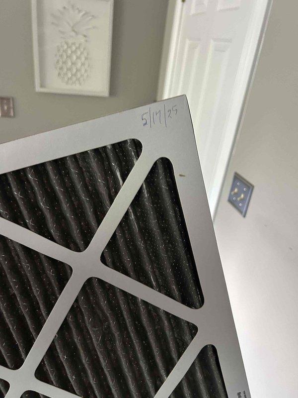 Responded to no cooling complaint on first floor system. Upon arrival, thermostat displayed 79°F with setpoint at 72°F. Inspected air handler and found severely restricted air filter with significant debris accumulation, reducing airflow and causing inadequate cooling performance. Removed and replaced dirty filter with new filter dated 5/17/25. Verified system operation, confirmed proper airflow restoration, and left unit cooling effectively.