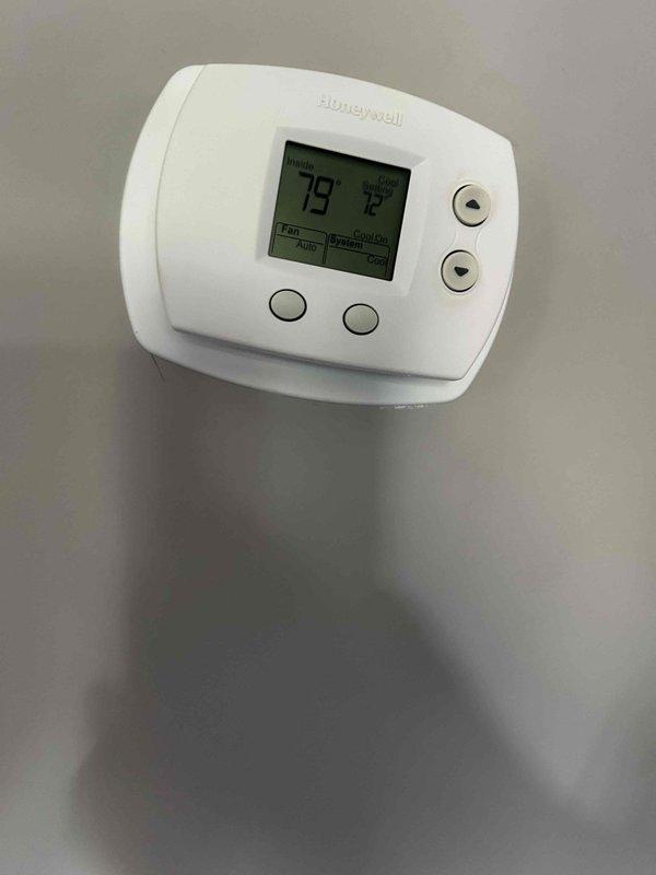 Responded to no cooling complaint on first floor system. Upon arrival, thermostat displayed 79°F with setpoint at 72°F. Inspected air handler and found severely restricted air filter with significant debris accumulation, reducing airflow and causing inadequate cooling performance. Removed and replaced dirty filter with new filter dated 5/17/25. Verified system operation, confirmed proper airflow restoration, and left unit cooling effectively.