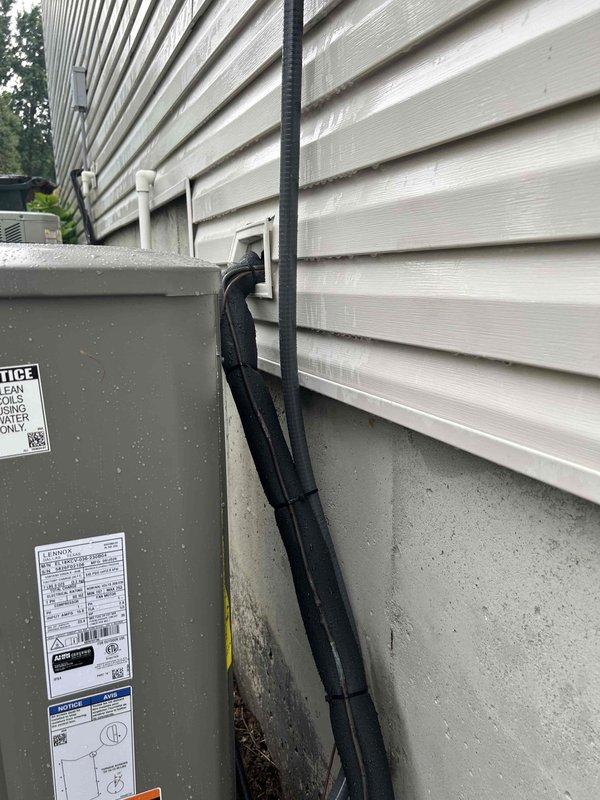 Completed full residential HVAC system replacement including installation of Lennox Elite Series 18 SEER2 variable capacity air conditioner (Model EL18KCV-036), Lennox Dave Signature Series 80% AFUE 90,000 BTU variable speed furnace (Model SL280UH090V48BK), and matching evaporator coil (Model CK40CT-036B-71). Removed and properly disposed of existing equipment per code requirements.

Installed outdoor condensing unit on concrete pad with electrical whip kit, disconnect box, and insulated refrigerant lines with filter drier. Mounted unit against exterior wall with properly secured black conduit for electrical connections. Indoor installation included furnace with variable speed blower, evaporator coil with transition fittings to existing ductwork, and standard air filter rack. Connected unit to existing flue piping with flame rollout protection. Installed flexible gas line connector with gas shutoff switch and electrical shutoff switch per code.

Modified basement return air ductwork to
