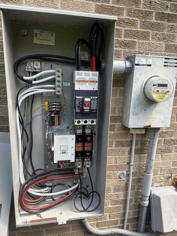 Completed comprehensive preventive maintenance on air-cooled standby generator including full fuel system inspection, battery electrical testing, and high/low voltage connection verification. Replaced spark plugs, air filter, and oil filter while inspecting generator enclosure and physical installation condition. Performed complete system test verification in both manual and automatic modes under load to confirm proper operation and transfer switch functionality.