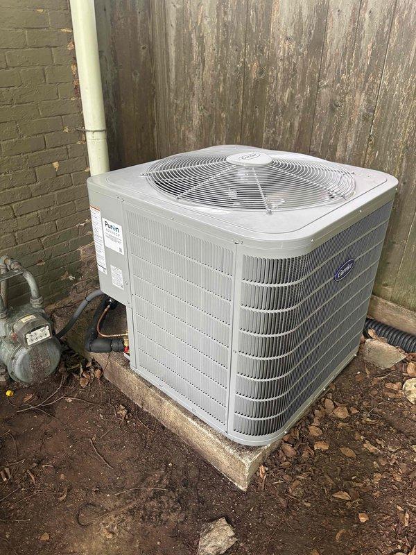 Replaced outdoor condensing unit under warranty claim. Removed failed ODU and installed new Puron ADVANCE model on existing concrete pad. Documented serial numbers and equipment tags from both old and new units with photographs as required for warranty processing. Verified proper refrigerant line connections and electrical disconnect. Unit operational upon completion.