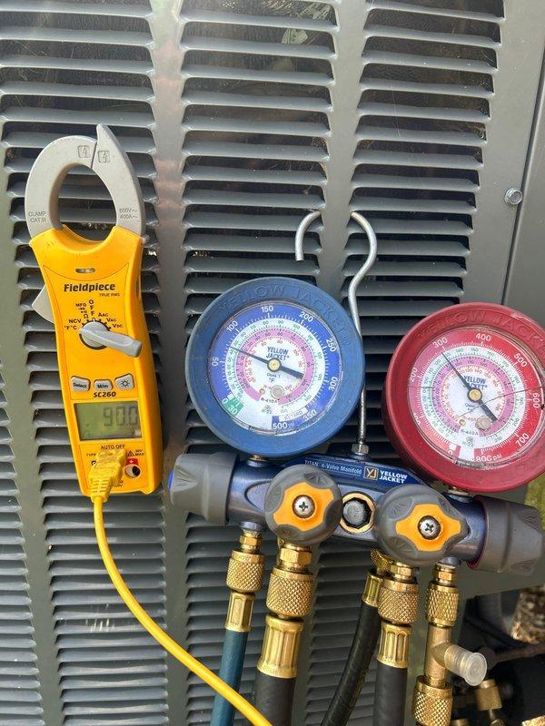 # HVAC Service Completed

Responded to service call for air conditioning system with inadequate cooling performance. Upon arrival, customer reported unit was operating but not maintaining desired temperature setpoint.

Performed comprehensive system diagnostics using calibrated test equipment. Connected manifold gauge set to measure refrigerant pressures on both high and low sides of the system. Utilized digital clamp meter to verify amperage draw on compressor circuit. 

Pressure readings and amperage measurements indicated system was operating outside normal parameters. Analysis of gauge readings on both suction and discharge sides revealed refrigerant charge discrepancy affecting cooling capacity. 

Conducted thorough inspection of condensing unit and evaporator coil accessibility points. Verified electrical connections and confirmed compressor was energizing properly based on amp draw measurements. System showed signs of reduced efficiency consistent with improper refrigerant level
