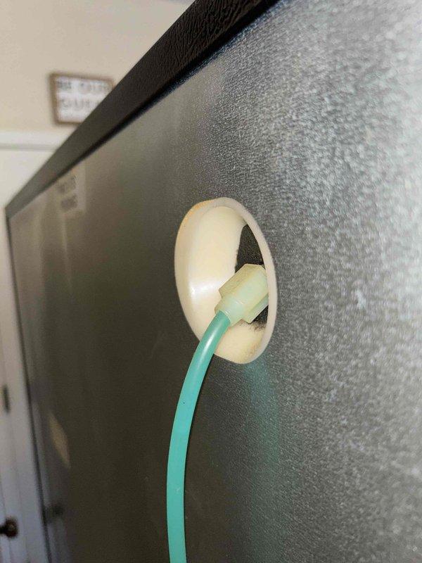 Completed ice maker installation to existing refrigerator unit. Routed water supply line through designated grommet port in appliance exterior panel and connected to refrigerator's internal water distribution system. Verified proper connection at ice maker compartment control panel and tested system functionality upon completion.