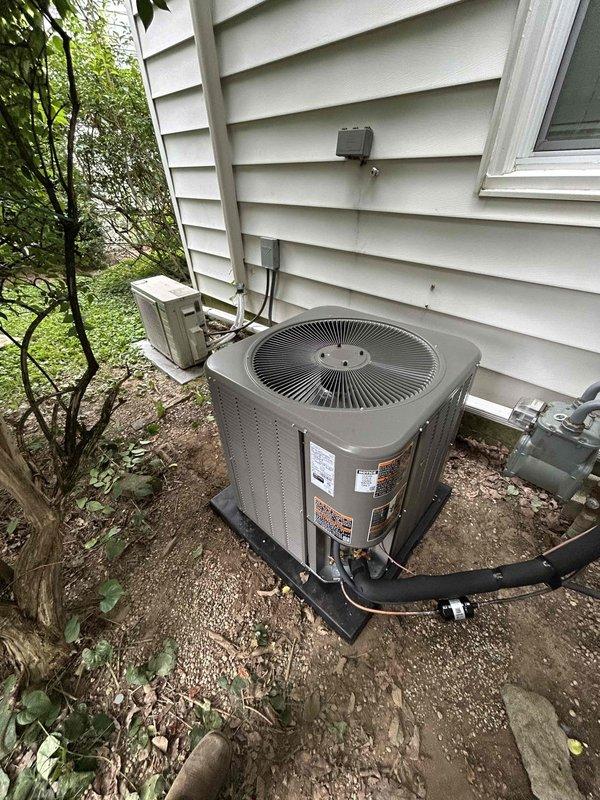 Completed residential installation of Lennox 14.3 SEER2 air conditioning system (model ML14KC1-30-230) with downflow evaporator coil (model CK40DT-30/36B) and new Honeywell S200 thermostat. Removed and properly disposed of existing equipment, obtained applicable permits, and installed new outdoor condenser unit on concrete pad with proper refrigerant line connections and electrical service including weatherproof disconnect box. Installed indoor coil assembly with condensate pump and connected copper refrigerant lines to air handler. Repaired and replaced ductwork in crawlspace to ensure proper airflow distribution throughout home. Reconnected existing furnace and adjusted blower speed settings to optimize air delivery to living areas. System tested and verified operational with proper refrigerant charge, airflow, and temperature differential. Enrolled customer in maintenance care plan including semi-annual inspections and extended warranty coverage on repairs.