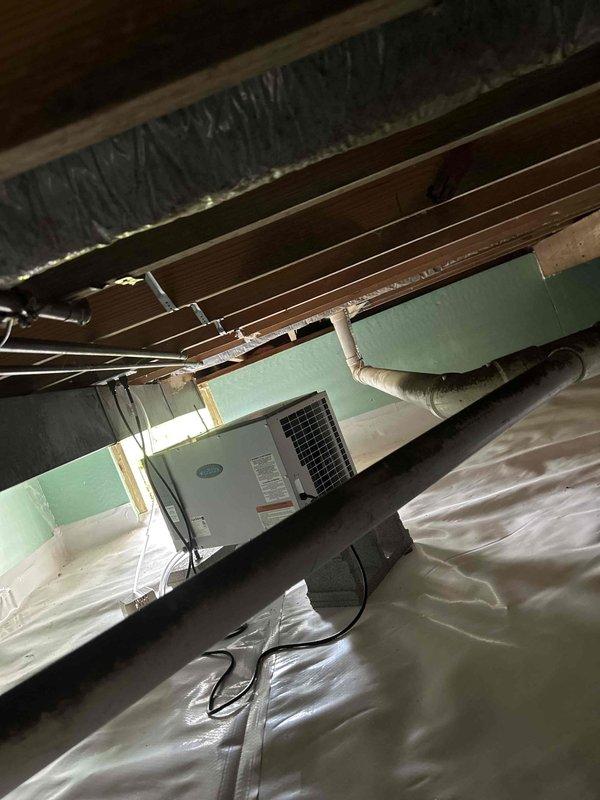 Conducted plumbing estimate for gas line installation to convert existing wood-burning fireplace to gas. Assessed crawl space and attic access points to determine routing options from existing gas water heater location to fireplace area. Evaluated structural components, existing copper plumbing lines, HVAC ductwork clearances, and vapor barrier conditions to plan gas line path through unfinished spaces while maintaining code compliance and proper separation from other utilities.