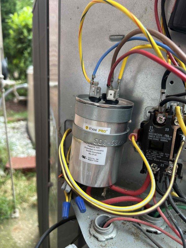 Replaced failed 45/5 dual-run capacitor with new TITAN PRO unit to restore proper compressor and condenser fan operation. Installed new 3/4" Armaflex insulation on exposed lineset to prevent condensation and improve energy efficiency. Repaired ductwork penetration at 90-degree elbow entering kitchen using single joist panning and foil tape, eliminating air loss without requiring drywall modification.