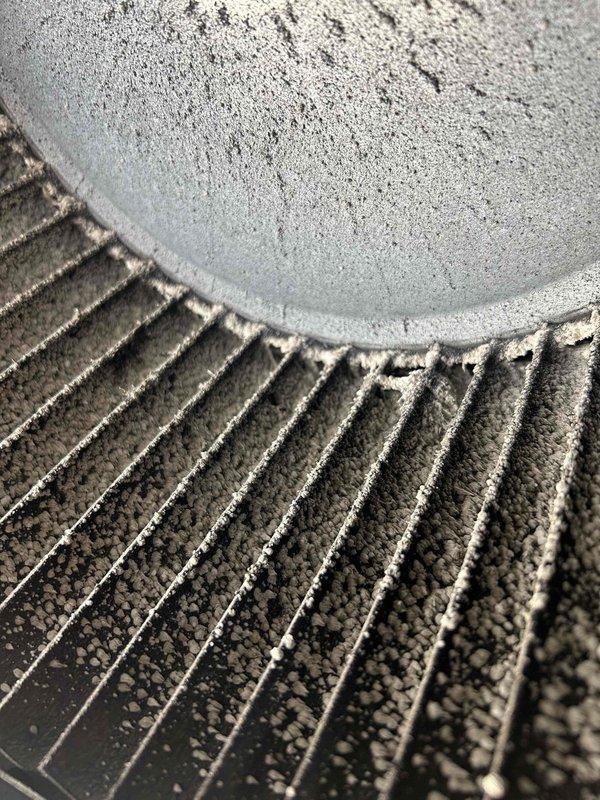 Responded to customer concern regarding excessive condensation on ductwork causing water dripping that was mistaken for a roof leak. Upon inspection, discovered heavily frosted refrigerant line and dirty evaporator coil fins with significant debris accumulation restricting airflow. Identified root cause as restricted airflow due to dirty coil and improper insulation on refrigerant lines, leading to below-dewpoint surface temperatures and subsequent condensation. Documented conditions with photos showing frost buildup on copper lines and contaminated coil fins requiring cleaning and insulation repair to resolve moisture issues.