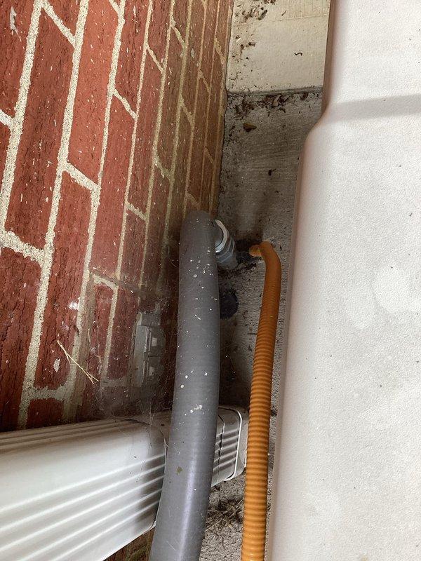 Conducted comprehensive electrical assessment for standby generator installation. Evaluated existing electrical infrastructure including main service panel, transfer switch location, and routing pathways for generator feeders. Documented current electrical configuration with Generac equipment already present, noting existing conduit runs, wire terminations, and panel connections. Assessed exterior utility routing where PVC conduit and flexible conduit converge at building corner, observing moisture conditions that may impact installation planning. Photographed open electrical panels revealing multi-conductor feeders, bus bar connections, and existing generator interface components to provide accurate material and labor estimates for completing the generator electrical integration.