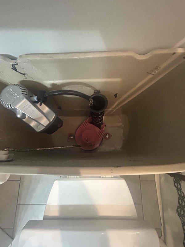 Completed comprehensive 65-point plumbing inspection of residential property without performing flush tests. Conducted exterior evaluation of hose bib mounted on building siding, confirming proper water flow and valve operation. Performed interior inspection of toilet tank components, verifying fill valve assembly, flush valve mechanism with flapper, and overflow tube functionality. Documented all findings with photographic evidence showing operational plumbing fixtures in standard working condition.