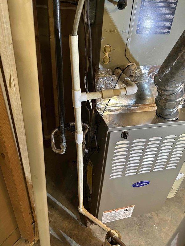 Completed residential furnace installation of a Carrier Infinity 58TP0B110V21-22 two-stage gas furnace rated at 110,000 BTU with 80% AFUE efficiency in a 21-inch cabinet configuration for 5-ton system capacity. Removed and properly disposed of existing heating equipment, then installed new unit in basement location with all required transitions to existing evaporator coil, standard air filter rack, and connection to flue piping system. Installation included flexible gas line connector with gas shut-off switch, electrical shut-off switch, flame roll-out protection, and all necessary PVC condensate drain lines. Secured all applicable permits, completed work in compliance with local building codes, and verified proper system operation upon startup. Unit is covered under manufacturer warranty including 1-year labor, 10-year parts, and 20-year heat exchanger protection.