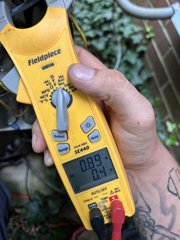 Completed comprehensive AC tune-up on 12-year-old cooling system located in basement. Performed standard maintenance procedures including inspection of condensation drainage, verified proper operation of all components, and checked electrical readings using clamp meter. Customer-supplied media cabinet filter #310 was inspected at AC/GF unit, and all systems found operating within normal parameters with no issues identified.