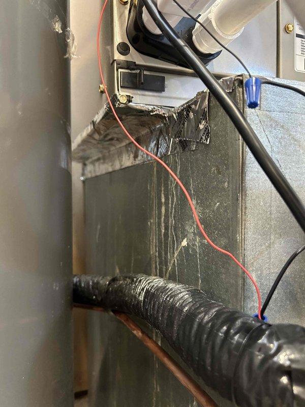 Completed full HVAC system installation for new condo construction, installing a Bryant 2-ton 14.3 SEER2 heat pump system. Installed outdoor unit model GH5SAN52400A on new concrete pad with snow legs for elevation and protection. Mounted indoor air handler model FJ5ANXB24L00 with integrated 10KW electric heat kit model TU-EC-10BKB in attic space. 

Ran new dedicated electrical wiring from breaker panel to heat pump outdoor unit to meet code requirements for the system. Installed electrical disconnect box at outdoor unit and electrical whip kit for proper connections. Set refrigerant lines with proper insulation and installed refrigerant line filter for system protection. Connected and insulated copper refrigerant tubing between outdoor and indoor units.

Installed condensate drain trap and SS2 coil drain safety water sensor on air handler. Added "Ceiling Saver" overflow drain pan with secondary water sensor beneath unit for leak protection. Fabricated and installed transition ductwork 