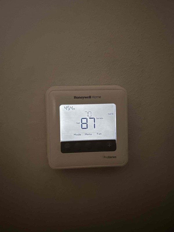 Responded to no-cool call on 5-year-old heat pump system serving upstairs zone. Upon arrival, found thermostat display active and calling for cooling, but air handler completely unresponsive with no power to unit. Accessed attic-mounted indoor unit and performed electrical diagnostics. Measured supply voltage at disconnect and traced power supply to air handler control board. Identified failed low-voltage transformer preventing system operation. Replaced defective transformer, restored power to control circuit, and verified proper 24VAC output. Cycled system through cooling mode, confirmed blower motor operation and proper airflow at registers. System restored to full operational status with normal cooling capacity.