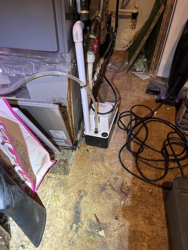 Responded to air conditioning system not cooling properly at residential property. Upon arrival, performed comprehensive diagnostic evaluation of 11-year-old AC system. Conducted visual inspection of indoor air handler unit located in utility room, checking for proper airflow and mechanical operation. Measured supply register temperatures using digital thermometer to verify cooling performance and temperature differential across the system. Inspected condensate drain lines, refrigerant lines, and electrical connections at the air handler. Evaluated ductwork connections and system components for proper operation. System assessment completed and findings documented with photographic evidence of equipment condition and diagnostic measurements.