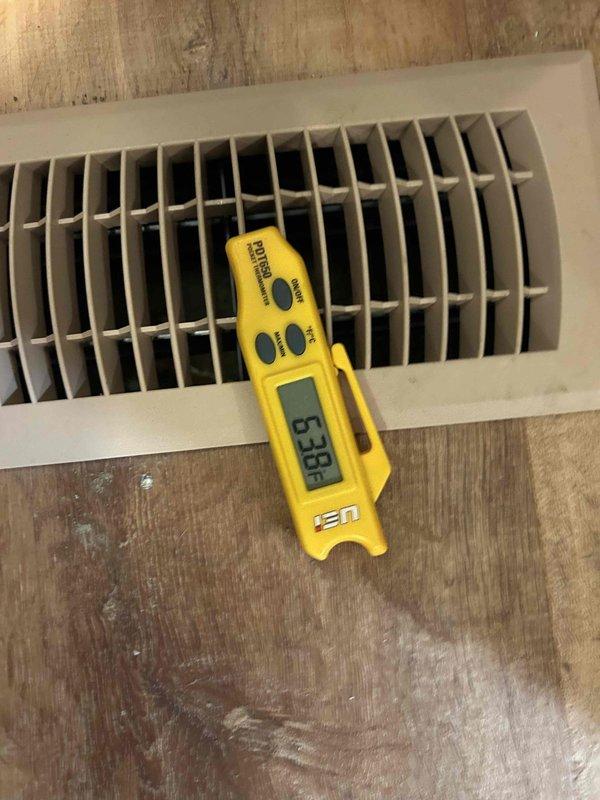 Responded to air conditioning system not cooling properly at residential property. Upon arrival, performed comprehensive diagnostic evaluation of 11-year-old AC system. Conducted visual inspection of indoor air handler unit located in utility room, checking for proper airflow and mechanical operation. Measured supply register temperatures using digital thermometer to verify cooling performance and temperature differential across the system. Inspected condensate drain lines, refrigerant lines, and electrical connections at the air handler. Evaluated ductwork connections and system components for proper operation. System assessment completed and findings documented with photographic evidence of equipment condition and diagnostic measurements.