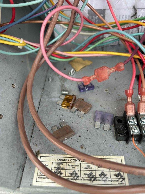 Responded to no cool call on commercial rooftop gas package unit (8-10 ton) with zoning issues affecting multiple zones. Upon inspection, discovered problematic wiring conditions in electrical control panel with disorganized wire routing and scattered fuses indicating previous service attempts or failures. Inspected blower assembly, belt drive system, and heat exchanger coil which showed signs of age with visible surface corrosion and dust accumulation. Diagnosed zoning malfunction related to control wiring and damper operation causing uneven cooling distribution throughout building. Performed system evaluation and documented existing conditions of electrical components, blower motor assembly, and internal cabinet components for repair recommendations.