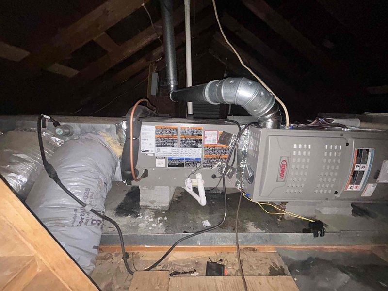Responded to same-day callback for newly installed Lennox 70K BTU 80% gas furnace (ML180UH070E36AK), 2.5 ton 15.5 SEER2 AC unit (ML14KC1-030-230), evaporator coil (CK40HT-24A-71), and Aprilaire 1000 media cabinet with report of no power to system. Upon arrival, verified attic installation and inspected all equipment connections. Discovered thermostat wiring issue preventing system activation. Corrected low voltage wiring connections at thermostat and furnace control board, verified proper 24V circuit continuity, and restored power to system. Cycled furnace through complete heating operation, confirmed proper ignition sequence, burner flame characteristics, and blower motor function. Verified digital thermostat communication and programming. System now operating normally with all safety controls functioning as designed.