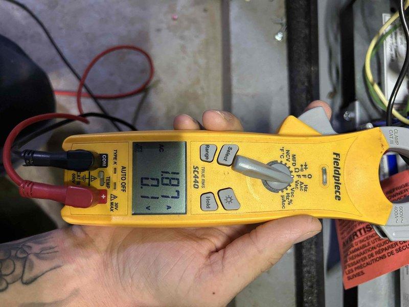 Completed scheduled Care Plan tune-up on geothermal HVAC system with washable filter. Performed diagnostic testing using digital clamp meter, recording amperage readings of 16.3A and 71.4A to verify proper system operation. Confirmed Air Scrubber air purification unit, installed in November 2022, is functioning correctly with LED indicator illuminated and integrated properly within the ductwork system.