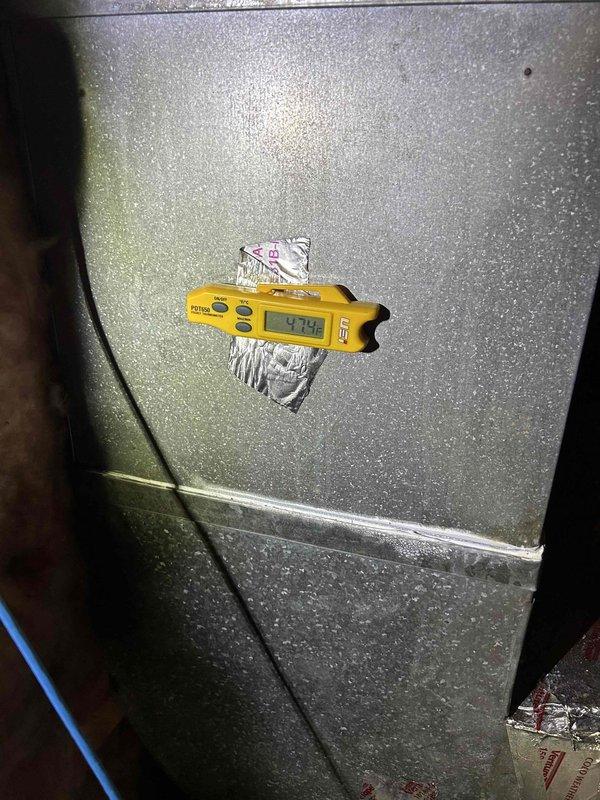 Responded to callback for newly installed AC system failing to maintain adequate cooling during daytime hours. Upon arrival, performed diagnostic assessment including temperature differential measurements at supply ductwork, which revealed 47.9°F supply air temperature. Inspected air filter at return air grille and found moderate dust accumulation on pleated media, though not severely restricted. System demonstrated proper refrigerant temperatures and compressor operation, with cooling performance degradation correlating with peak solar load conditions. Documented system conditions with photographic evidence of supply air temperatures and filter condition for ongoing performance evaluation of new installation.