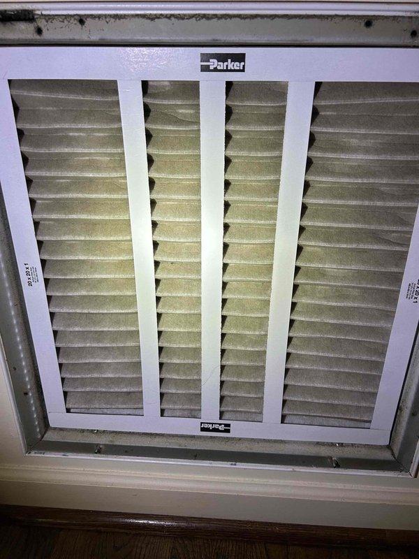 Responded to callback for newly installed AC system failing to maintain adequate cooling during daytime hours. Upon arrival, performed diagnostic assessment including temperature differential measurements at supply ductwork, which revealed 47.9°F supply air temperature. Inspected air filter at return air grille and found moderate dust accumulation on pleated media, though not severely restricted. System demonstrated proper refrigerant temperatures and compressor operation, with cooling performance degradation correlating with peak solar load conditions. Documented system conditions with photographic evidence of supply air temperatures and filter condition for ongoing performance evaluation of new installation.