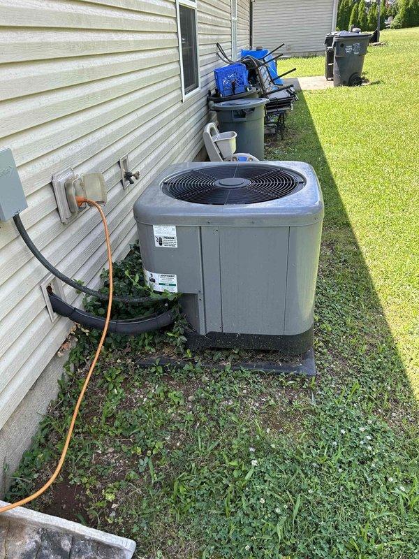Responded to non-urgent service call for drain pan filling up and overflowing on residential HVAC system. Upon arrival, inspected air handler unit and identified clogged condensate drain line as primary cause of water accumulation. Evaporator coil showed visible dust and debris buildup on fins, contributing to restricted airflow and excess condensation. Cleared condensate drain line obstruction using appropriate methods to restore proper drainage. Verified drain pan was emptying correctly after clearing blockage. Recommended filter replacement and coil cleaning to prevent future drainage issues and maintain system efficiency. Unit cooling properly at time of service completion with condensate draining as designed.