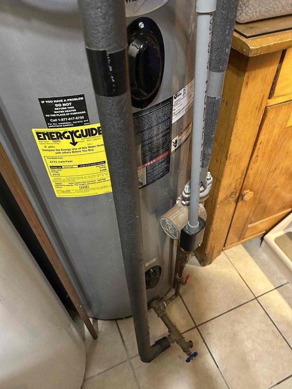 Responded to emergency service call for 20-year-old 80-gallon electric water heater with water leaking from access panels in mechanical room. Upon inspection, confirmed active leaking from tank body, indicating internal tank failure typical of units at end of service life. Due to age of unit, extent of corrosion, and customer's request for same-day resolution, recommended full replacement rather than repair. Removed existing failed water heater and installed new 80-gallon electric residential water heater in same location. Connected all supply and discharge plumbing lines, verified proper electrical connections, installed new temperature and pressure relief valve with appropriate discharge piping, and ensured all code-compliant safety features were in place. Filled tank, purged air from system, tested all connections for leaks, and verified unit achieved proper operating temperature. Cleaned work area and removed old water heater from premises. System fully operational upon completion.