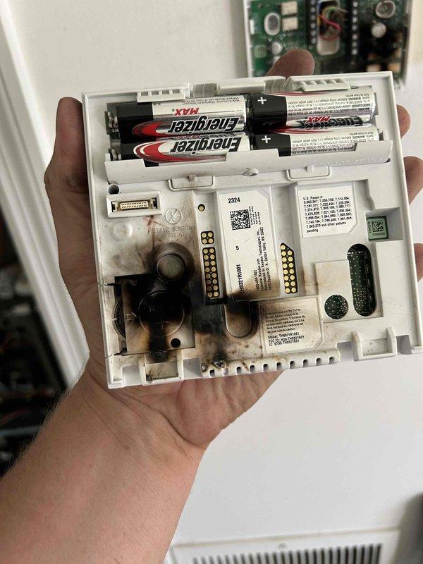 Responded to no-cool call on 9-year-old Lennox system with thermostat reporting loss of power to air conditioning unit. Upon inspection, discovered failed contactor with severely burned and deteriorated copper coil windings showing extensive heat damage and corrosion. Replaced defective contactor, verified proper voltage at thermostat, confirmed fresh batteries installed, and restored full system operation with normal cooling cycle.