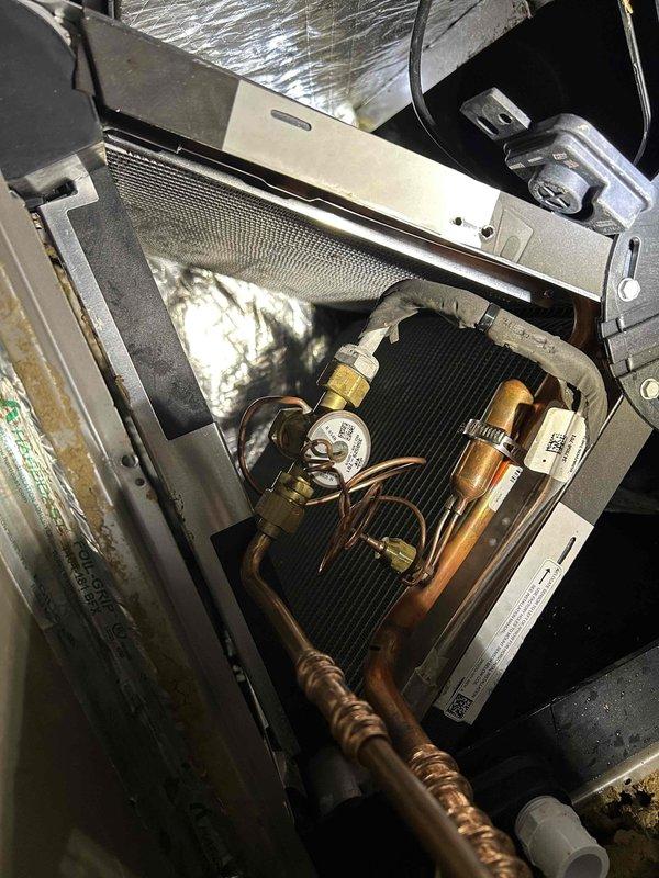 Responded to warranty service call for TXV replacement on HVAC system. Accessed indoor air handler unit, removed existing thermal expansion valve from refrigerant circuit, and installed new factory-authorized replacement TXV. Brazed copper connections, pressure tested system for leaks, and verified proper refrigerant flow through metering device. System restored to normal operating condition with all components functioning within manufacturer specifications.