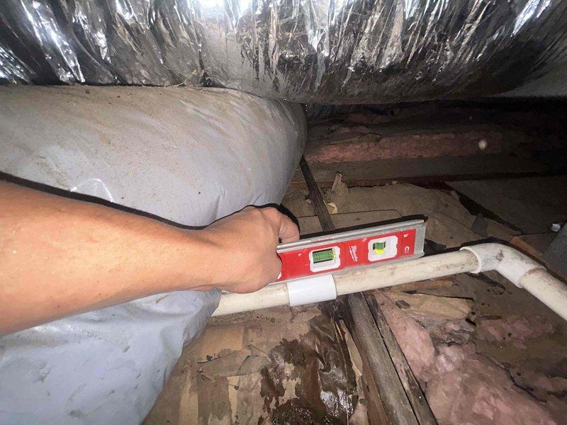 Completed full HVAC system replacement including installation of Lennox 2.5-ton air conditioner (ML14KC1-024), 93% efficiency 70,000 BTU furnace (ML193UH070XE36BK), and evaporator coil (CK40HT-36B) in crawl space. Installed Friedrich 2-ton dual-head mini-split system (FPHMR27A3D outdoor unit with FAHFW12A3D indoor head) in upstairs area to replace existing in-wall AC units. Capped off existing ductwork to upstairs bedrooms to improve airflow balancing and system efficiency in lower living area.

Installation included outdoor unit pad, electrical whip kit, disconnect boxes, refrigerant line insulation, filter drier, and transitions from evaporator coil to existing ductwork. Installed SS2 coil drain safety water sensor for overflow protection. Furnace installation included standard air filter rack, connections to existing flue piping, electrical and gas shut-off switches, flexible gas line connector, and flame roll-out protection. Ran new electrical wiring from main breaker panel to outd