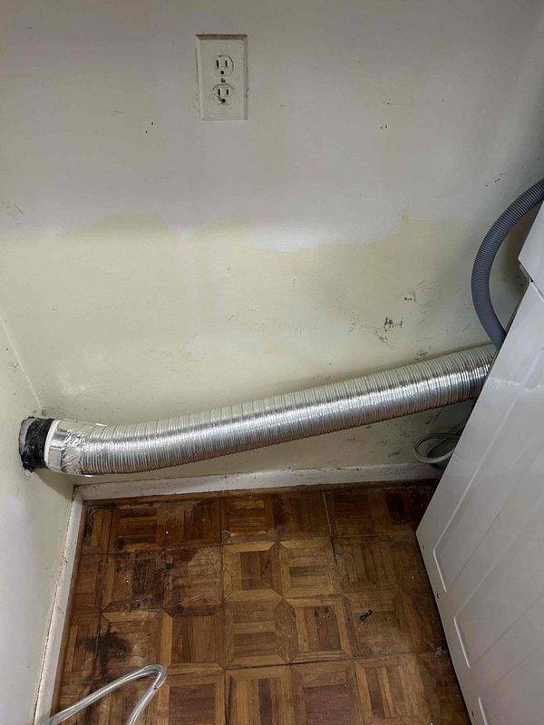 Responded to service call for water shut-off required prior to appliance installation. Located and operated existing brass quarter-turn ball valve with blue handle to isolate water supply. Verified proper shut-off function of valve controlling metallic braided stainless steel supply line and gray corrugated flexible hose connections, allowing safe disconnection for appliance replacement work to proceed.