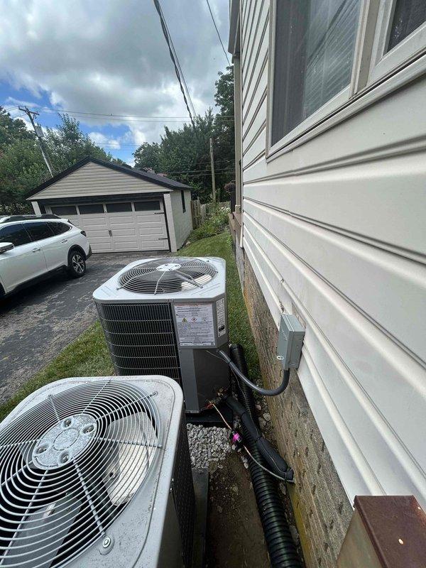 Completed full residential HVAC system installation of Bryant 14.3 SEER2 2.5-ton air conditioning unit (model GA5SAN5300W) with matching evaporator coil (model CVAMA3017XMA). Prepared ground stabilization by spreading 3-4 buckets of gravel under existing pad location to ensure proper base support before setting new outdoor unit pad. Installed complete outdoor unit package including electrical whip kit, electrical disconnect box, and refrigerant line set with proper insulation. Added refrigerant line filter drier for system protection. Fabricated and installed transition ductwork to properly connect evaporator coil to existing duct system. Installed SS2 coil drain safety water sensor to provide secondary overflow protection. Evacuated refrigerant lines, charged system to manufacturer specifications, and performed complete operational testing to verify proper cooling performance and system functionality.