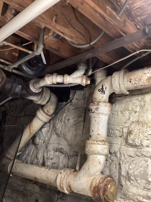 Conducted comprehensive electrical estimate for residential backup generator installation. Evaluated existing infrastructure including basement utility area with aging plumbing systems and exterior equipment placement options near air conditioning condenser unit. Assessed electrical service capacity, reviewed potential generator placement locations considering foundation ventilation requirements and landscaping clearances, and documented site conditions through photographic survey. Identified suitable installation pathway for generator transfer switch wiring from main electrical panel through basement utility space. Provided detailed specifications for automatic transfer switch installation, generator pad placement, and necessary electrical connections to meet current NEC requirements for standby power systems.