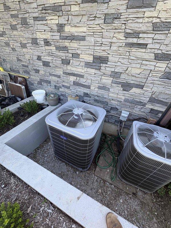 Completed full residential HVAC system installation featuring a Carrier Comfort Series 2.5 ton 16 SEER2 heat pump (model 27SCA530A003), matching 2.5 ton air handler (model FJ5ANXB30L00), and 15kW heat kit (model AFAEHL15B01A). Removed and properly disposed of existing equipment, then installed outdoor heat pump unit on new pad with snow legs, electrical disconnect box, and whip kit. Installed indoor air handler with insulated refrigerant lines, refrigerant line filter, trap, SS2 coil drain safety water sensor, and transitioned to existing ductwork with standard-sized air filter rack. Integrated existing thermostat with new system and completed all electrical connections to code with applicable permits obtained.
