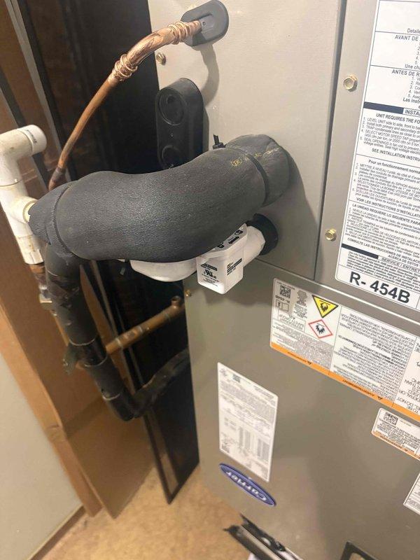 Completed full residential HVAC system installation featuring a Carrier Comfort Series 2.5 ton 16 SEER2 heat pump (model 27SCA530A003), matching 2.5 ton air handler (model FJ5ANXB30L00), and 15kW heat kit (model AFAEHL15B01A). Removed and properly disposed of existing equipment, then installed outdoor heat pump unit on new pad with snow legs, electrical disconnect box, and whip kit. Installed indoor air handler with insulated refrigerant lines, refrigerant line filter, trap, SS2 coil drain safety water sensor, and transitioned to existing ductwork with standard-sized air filter rack. Integrated existing thermostat with new system and completed all electrical connections to code with applicable permits obtained.