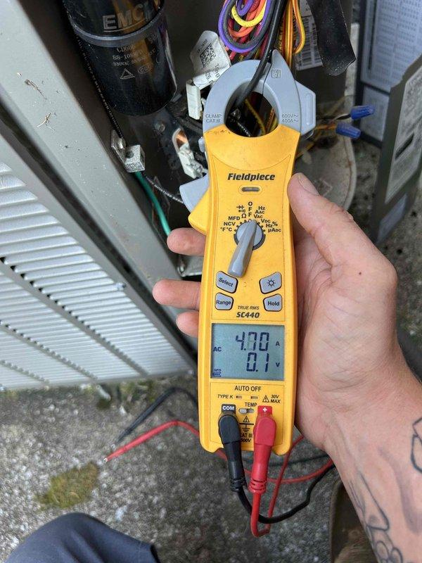 Completed prepaid Gold Level maintenance on dual HVAC system with both units located in attic accessed via pull-down steps. Performed comprehensive tune-up on two air conditioning systems aged 8 and 11 years. Inspected and cleaned washable filters on both units. Conducted electrical diagnostics using clamp meter, verifying amperage draw of 55.0A and voltage readings of 420V on system components. Tested capacitors, motor windings, and electrical connections to ensure proper operation. All measurements within manufacturer specifications. Both systems operating efficiently with no deficiencies noted.