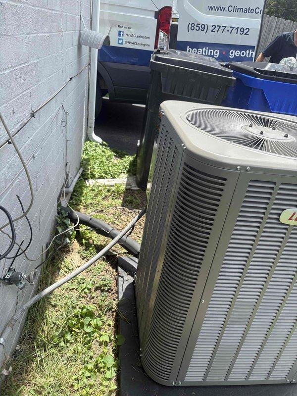 Completed residential HVAC system installation including a Lennox 2-ton 15 SEER2 air conditioning unit (model ML14KC1-024-230) and matching evaporator coil (model CK40CT-30B-71). Removed and properly disposed of existing equipment, then installed new outdoor condenser unit on concrete pad with electrical disconnect box, whip kit, and refrigerant line insulation. Indoor evaporator coil was mounted in utility room with transition to existing ductwork, refrigerant line filter drier, and SS2 coil drain safety water sensor installed per manufacturer specifications. Installed new digital thermostat and completed all electrical connections to code. System was charged with refrigerant, tested for proper operation, and verified all safety controls functioning correctly. Installation includes one-year labor warranty and ten-year parts warranty, with complimentary one-year maintenance plan enrollment.