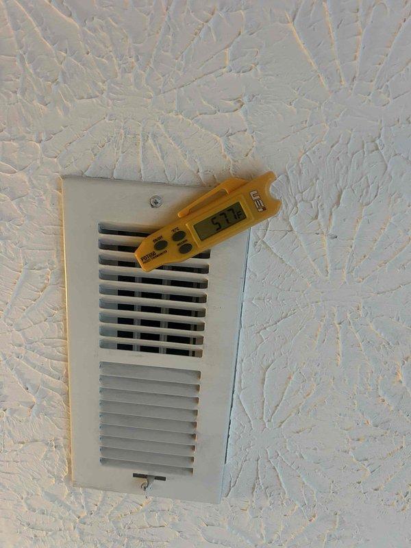Responded to after hours service call for 8-year-old electric heat pump system not maintaining desired temperature, with indoor conditions at 76 degrees despite thermostat set to 71. Performed diagnostic evaluation of system performance including temperature differential measurements at supply register. Inspected air handler unit and verified equipment model and serial number documentation. System assessed for cooling capacity and operational efficiency to determine cause of inadequate temperature control.