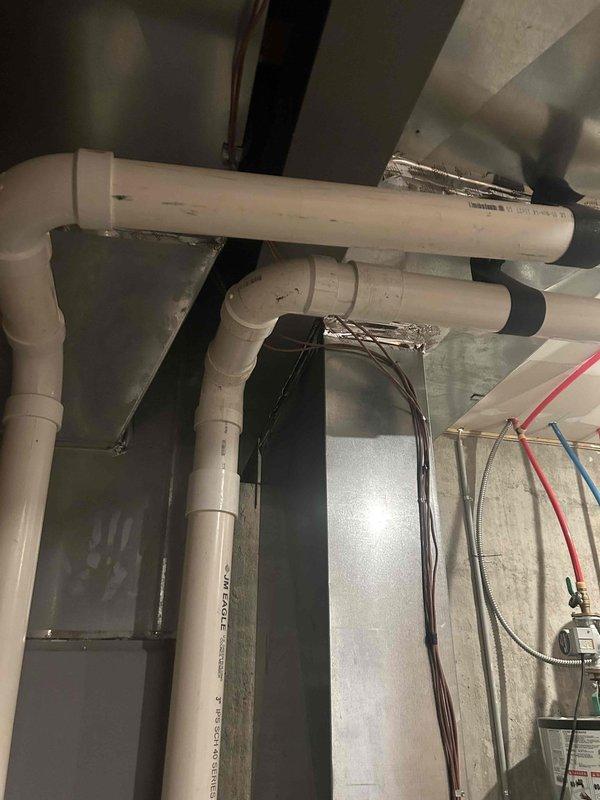 Responded to on-call service request for HVAC system requiring thermal expansion valve replacement and exhaust repair. Upon inspection, found severely corroded blower housing and exhaust assembly with significant rust accumulation and debris buildup affecting system performance. Removed and replaced defective TXV to restore proper refrigerant metering and system efficiency. Performed minor exhaust repairs to address deteriorated components and ensure safe operation. Cleared accumulated debris from blower assembly and verified proper airflow through mechanical space. All plumbing, electrical, and ductwork infrastructure inspected during service call. System tested and confirmed operational following repairs.
