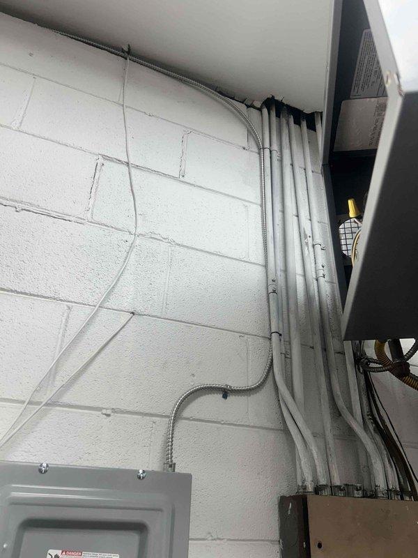 Responded to callback for recently installed mini-split system blowing warm air with hot lineset. Upon inspection, discovered improper electrical connections at breaker panel causing reversed polarity to outdoor unit. Corrected wiring at disconnect, verified proper voltage and phasing, tested system operation, and confirmed cooling mode functioning correctly with appropriate lineset temperatures.