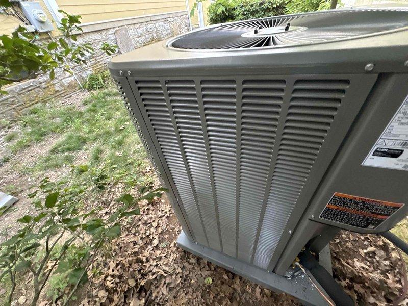 Completed full HVAC system installation including a Lennox 5-ton 14.3 SEER2 air conditioning unit with matching evaporator coil and 2-stage 90% efficiency gas furnace. Ran new refrigerant lineset with insulation and installed filter drier, mounted outdoor unit on pad with electrical disconnect box and whip kit, and installed SS2 coil drain safety water sensor. Fabricated transitions from evaporator coil to existing ductwork, installed standard air filter rack, connected furnace to flue piping, and installed electrical and gas shut-off switches with flexible gas line connector and flame roll-out protection. Tested all system operations and verified proper functionality of heating and cooling modes.