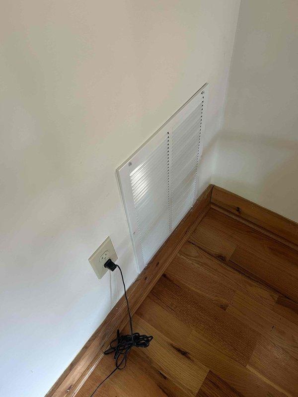 Responded to post-installation callback at guest house to address improperly secured vent cover and remaining installation debris. Properly reinstalled and secured wall-mounted return air vent cover with appropriate fasteners. Collected and removed leftover PVC components and materials from installation site, restoring work area to clean condition.